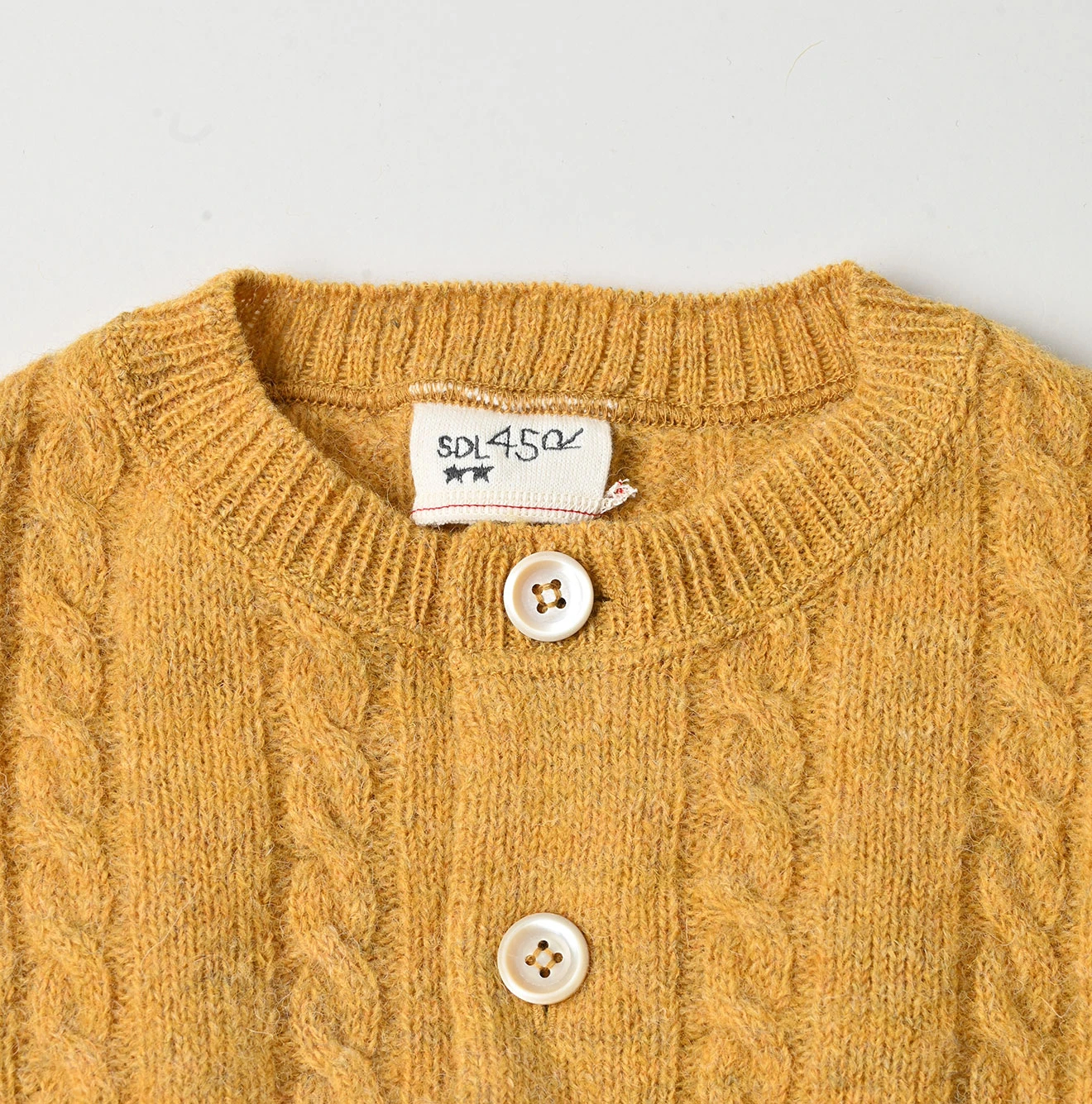 45R(フォーティファイブアール) |シェットランドケーブル縮絨のカーディガン