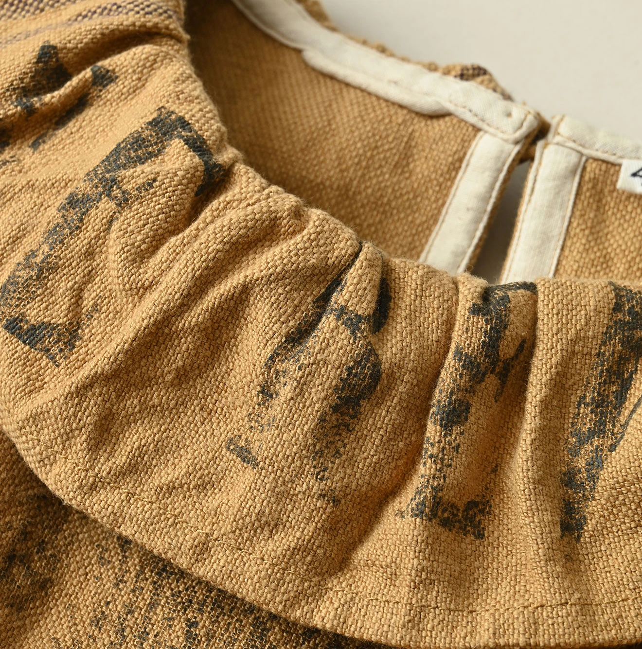 45R(フォーティファイブアール) |インドリネンサックのフリンジノースリーブトップ